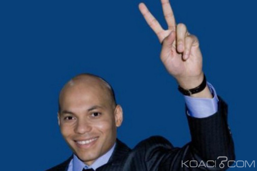 Sénégal: Karim Wade appelle à  voter NON au référendum, son père à  Dakar «si nécessaire»